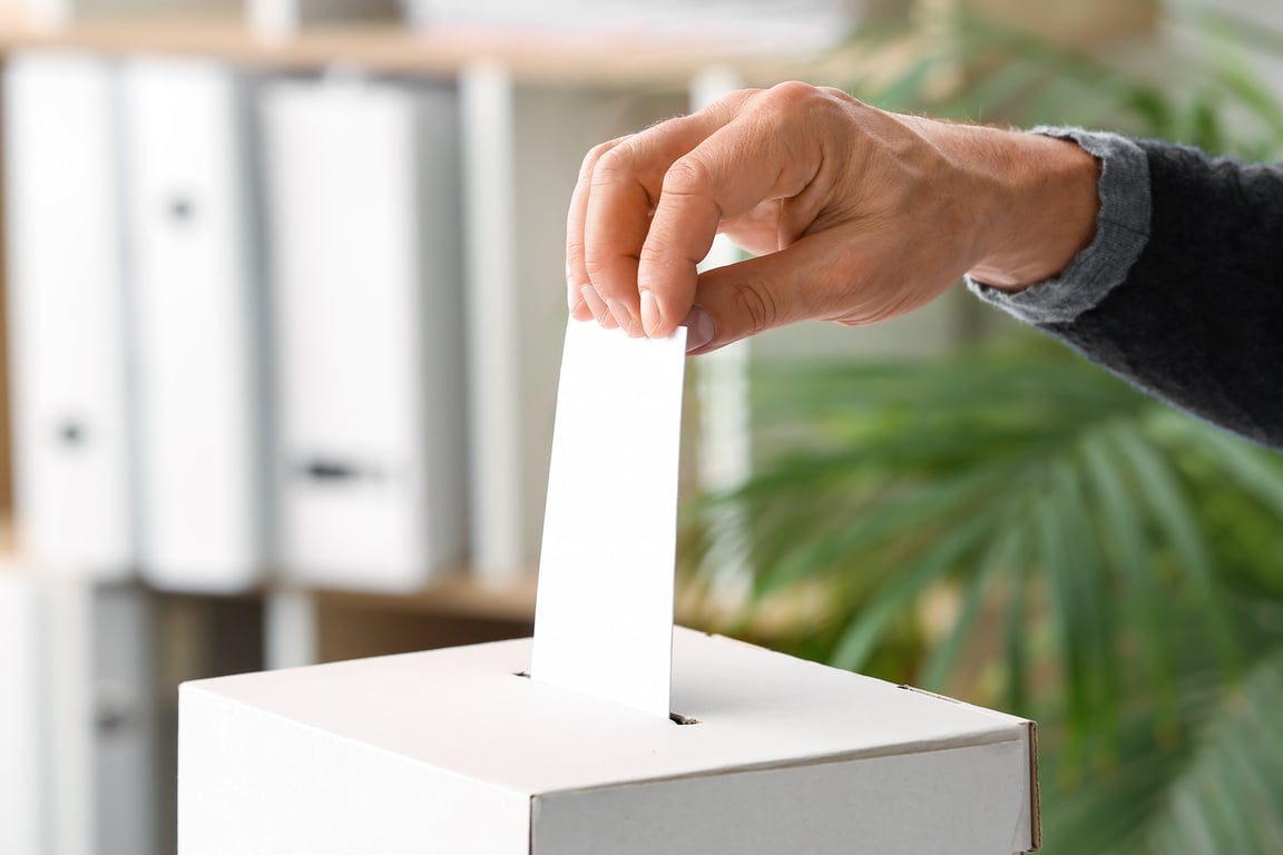 Man Voting at Polling Station