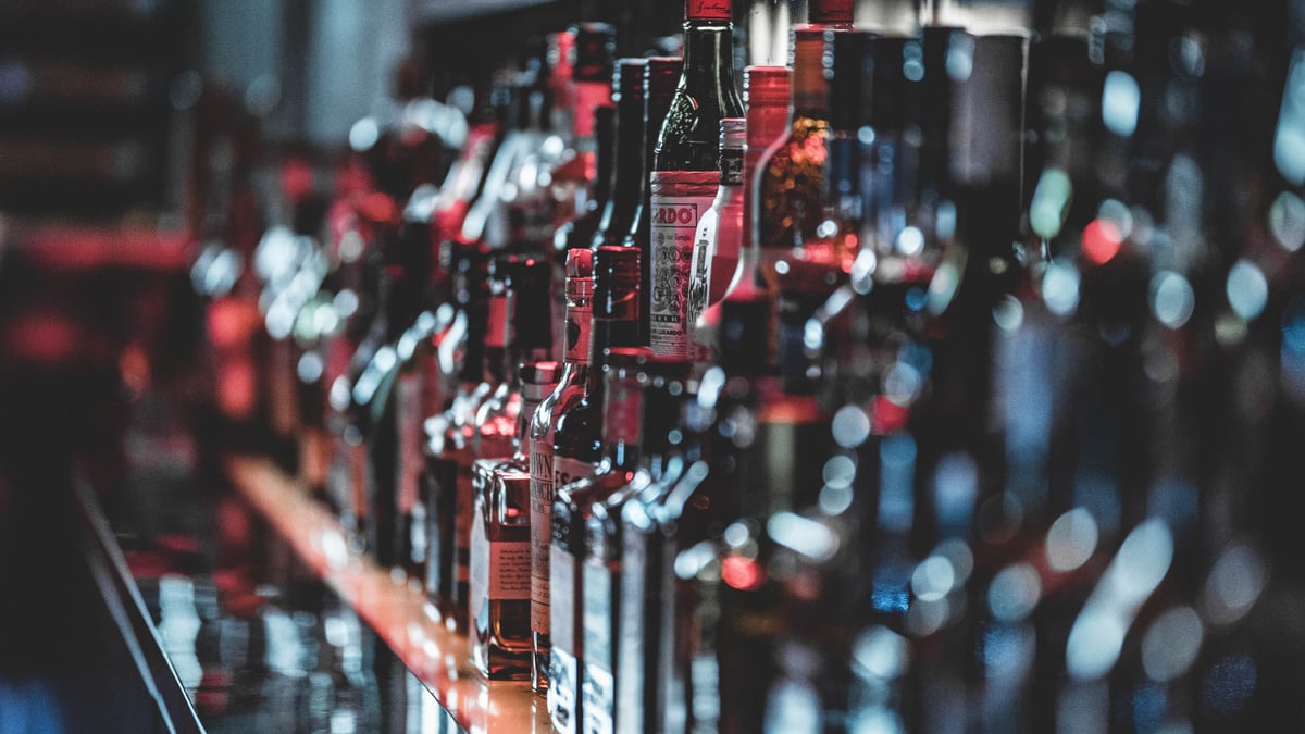 Selective Focus Photo Of Alcohol Bottles
